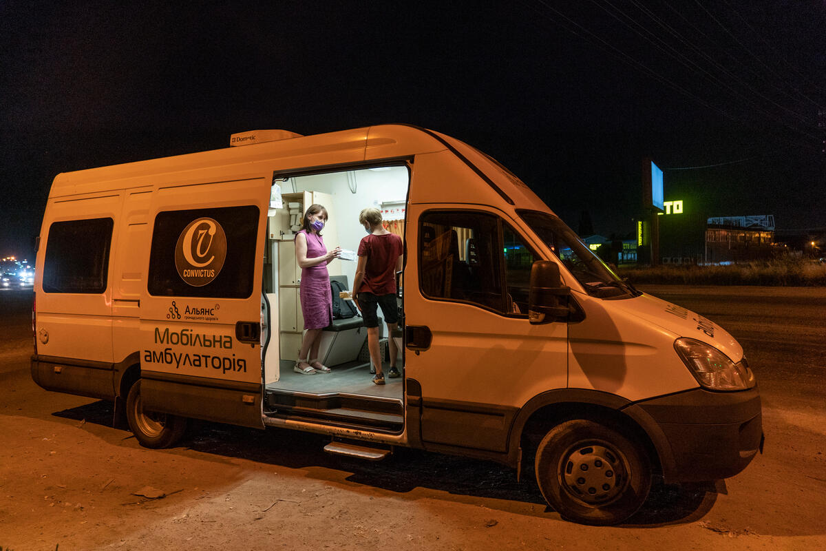 Social worker Natalia Sholokh provides consultation to Iryna, a sex worker, at a mobile clinic in Kyiv, Ukraine. Iryna: "I am very grateful to this team, they help us a lot. We receive condoms, get tested for HIV, and get free check-ups at the hospitals. We value being treated as humans."